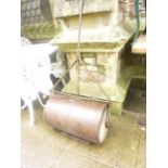 A vintage cast and wrought iron garden roller with T shaped handle