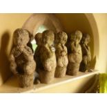 12 small weathered cast composition stone garden ornaments in the form of fawns in seated pose