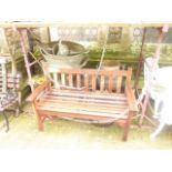 A stripped R A Lister teak two seat garden bench with slatted seat and back together with three