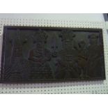 A Beninese (Nigerian) carved timber panel of rectangular form depicting three Obas, presented facing