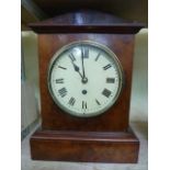 A late 19th century walnut bracket clock with eight day timepiece set beneath an architectural