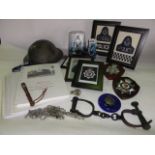 A box containing a selection of effects relating to the police including vintage shackles, a tin