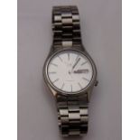 A gentleman's stainless steel wristwatch, Seiko 5 Automatic, the silvered dial with black