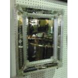 A Venetian glass easel framed dressing table mirror of rectangular form with foliate detail