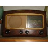 A vintage Cossor Melody Maker  501AC, set within a Bakelite case with simulated timber veneer