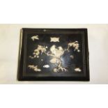 A 19th century Japanese lacquered photograph album the front cover overlaid with carved ivory detail