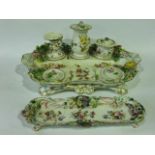 A good quality early 19th century standish in the Coalport manner with floral encrusted decoration