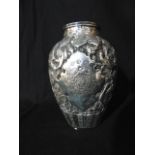 A possibly Persian silver vase, the ovoid body embossed with birds and floral decoration, 16cm high,