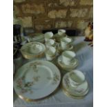 A quantity of Coalport dinner and teawares with apple blossom decoration including 6 dinner