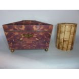 A sarcophagus shaped tea caddy constructed in faux tortoiseshell panels, raised on four brass bun