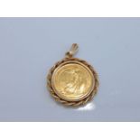 A 1/10 Oz Britannia coin pendant, 1987, with 9ct gold rope-twist border, 4.8g