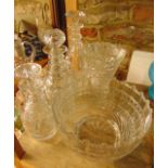 A good quality large clear cut glass bowl with shaped rim and extensive cut detail raised on a heavy
