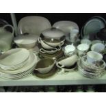 A collection of Poole Pottery dinner wares with mushroom and cream glazed finish comprising two oval