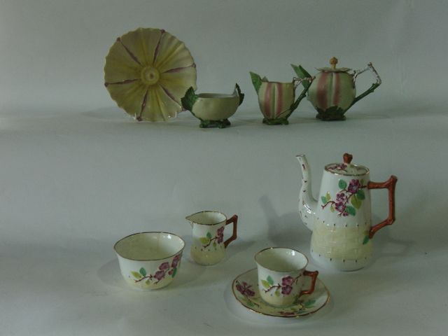 A collection of Royal Stafford coffee wares with relief moulded and painted prunus blossom