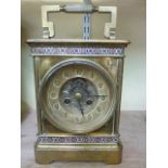 A 19th century brass table clock with champleve enamelled borders, the movement with visible