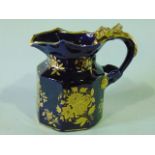 A 19th century Mason type jug of octagonal form with gilded floral sprigs and sprays on a dark