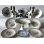 A collection of 19th century ceramics including a pair of Staffordshire spaniels with black and