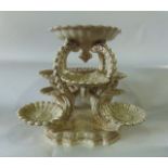 An unusual 19th century Fischer of Budapest table centrepiece with gilt decoration on a cream ground