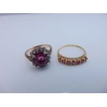 A ruby ring, set with seven round untested rubies, in 9ct gold, size Q; and a paste-set ring, the