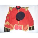 A Royal Artillery red ground jacket with sergeant stripes and applied epaulettes, etc, complete with