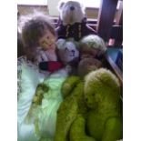 A box containing an assortment of vintage teddy bears, dolls, etc, to include a model of