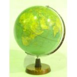 A vintage table top globe with a chromium axis supported on a worked timber stand, 43 cm tall approx