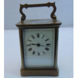 A simple French carriage clock with eight day timepiece