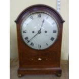 A late 19th century mahogany bracket clock, the mahogany case with string banded inlay with arched