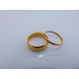 A 22ct gold wedding band, 1.4g, size M; and a 22ct gold wedding band, 5.6g, size L 1/2 (2)