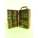 A contemporary champagne carrying case in stitched claret stained leather of rectangular form with
