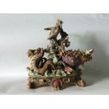 A substantial late 19th century continental majolica vase modelled as King Neptune driving a shell