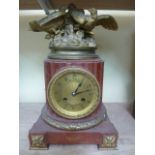 A 19th century French mantle clock, the eight day striking movement set within a fluted column set
