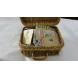 A wicker basket containing a miscellaneous collection of late 19th century and later greetings