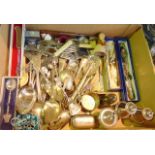 A box containing a mixed quantity of mostly silver plated cutlery to include serving spoons,
