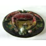 A Portuguese Palissy style charger with applied model of a crab, with further encrusted shell and