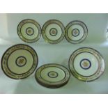 A set of nine continental dessert plates with painted floral sprays with blue, gilt and floral