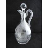 A fine late 19th century well etched clear glass claret jug detailed with a dashing hare in a