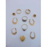 A pair of 15ct gold shirt studs, 1.9g in total; two pairs of 9ct gold earrings, 1.2g in total; a 9ct