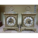 A pair  of 19th century style carriage clocks with cast brass bases with acanthus and other detail