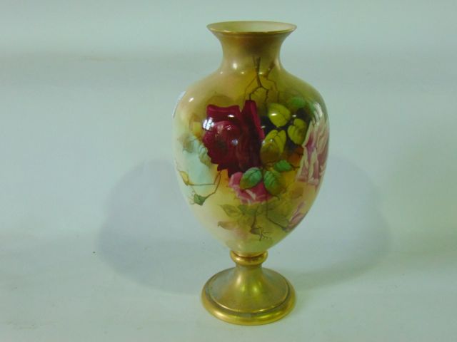 A Grainger Royal Worcester blush ivory vase of urn shaped form with painted pink rose decoration