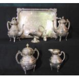 A four piece eastern white metal tea set comprising teapot, hot water pot, two handled lidded