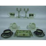 A pair of Herend two sectional two branch candelabra with green and gilt floral detail and printed