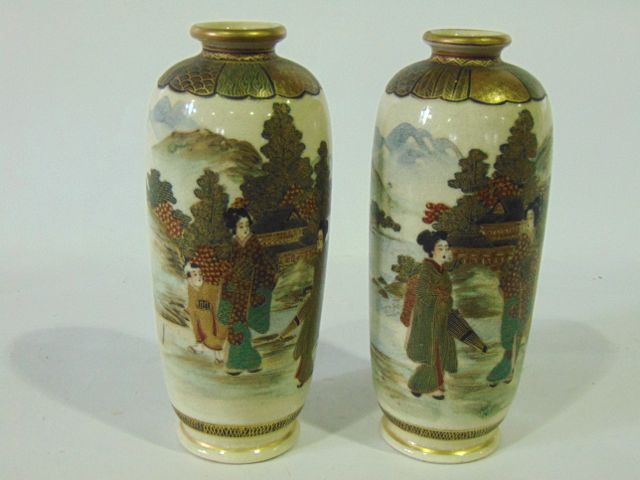 A pair of late 19th century Satsuma vases of ovoid form with female character decoration in a