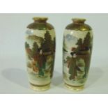 A pair of late 19th century Satsuma vases of ovoid form with female character decoration in a