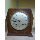 An Art Deco oak cased mantle clock enclosing a two train movement retailed by Mappin & Webb