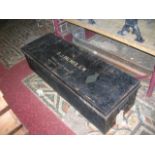 A vintage long and shallow japanned tin trunk with painted lettering to lid S J Palmer RM, etc