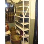 A freestanding painted steel shelving unit