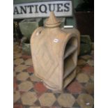 An unusual reclaimed buff coloured terracotta chimney pot/cowl of arched form with raised finial and