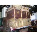 Three vintage canvas, fibre and timber banded cabin trunks of varying size together with a small