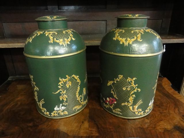 A pair of Victorian style tin tea canisters of cylindrical form with domed tops (complete with